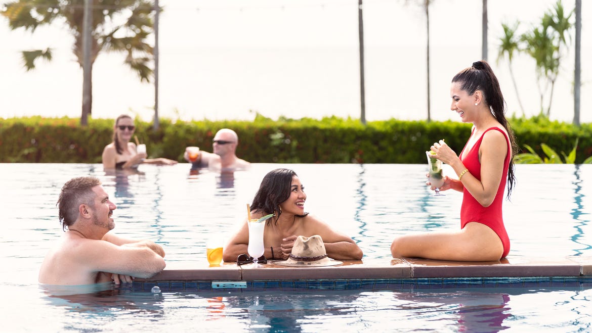 friends drinking by the pool mbcr