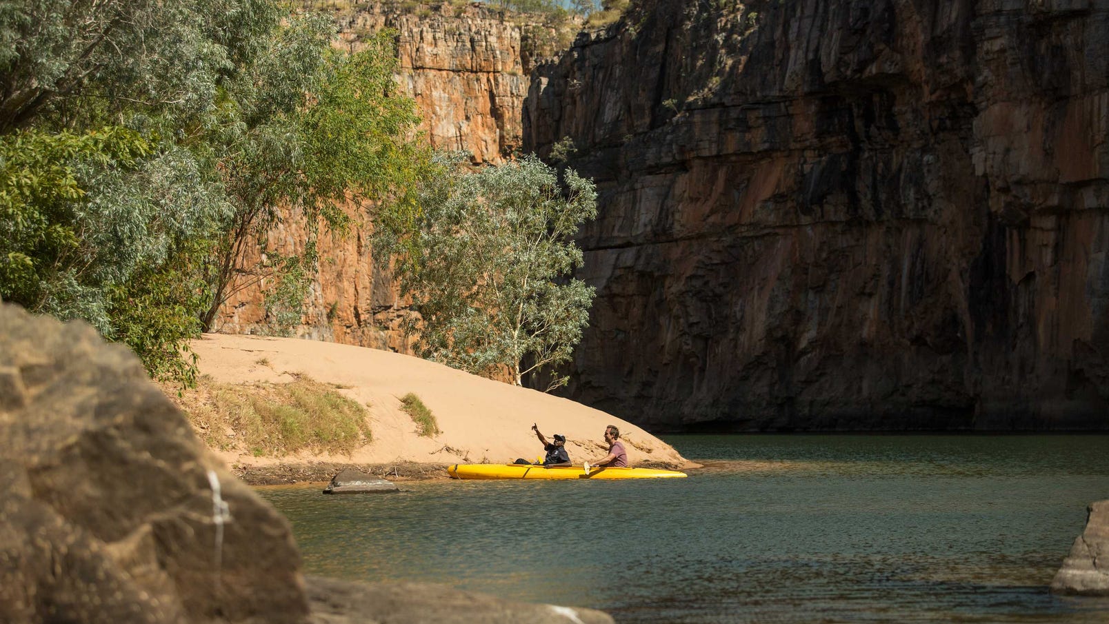 A visitor canoeing with an Aboriginal guide at Nitmiluk National Park