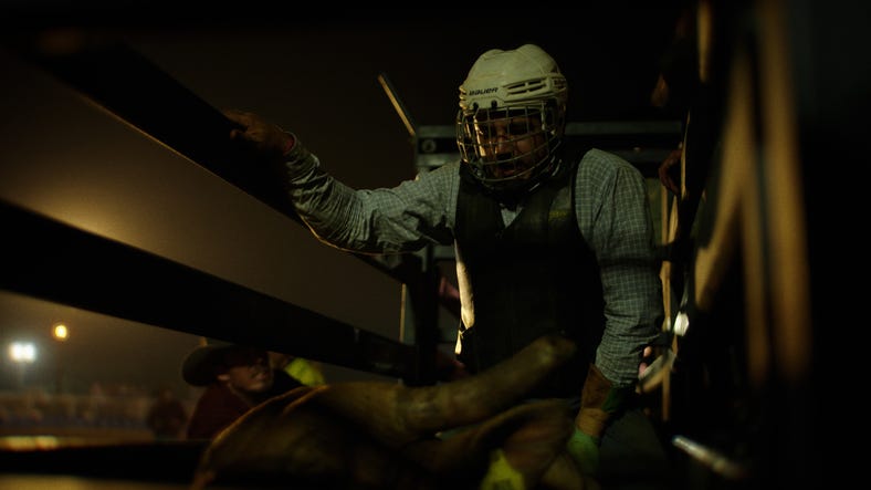 Man waiting in rodeo chute