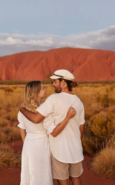 Couple standing together near Uluru