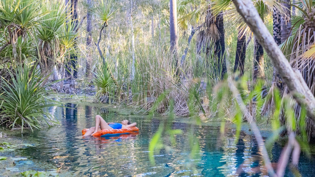 lady on a floaty at bitter springs