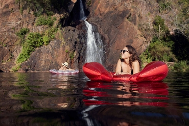 two women floating in Wangi falls