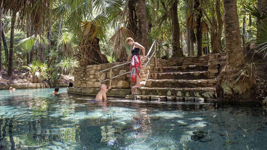 Couple relaxing in the Mataranka thermal pool near Katherine