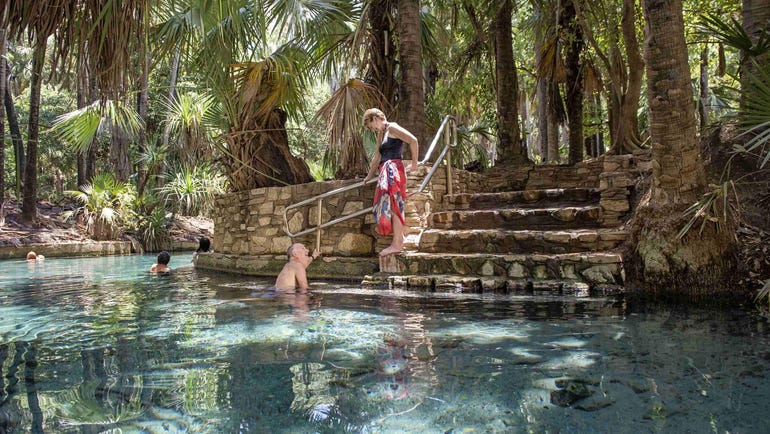 Couple relaxing in the Mataranka thermal pool near Katherine