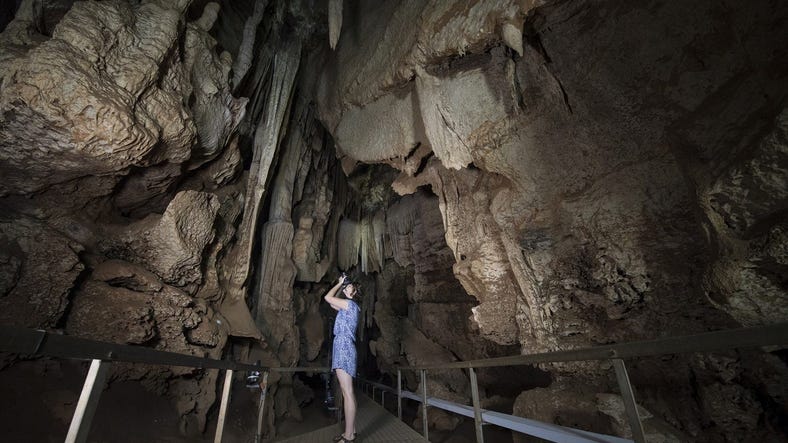 Person checking out the Cutta Cutta caves in Katherine