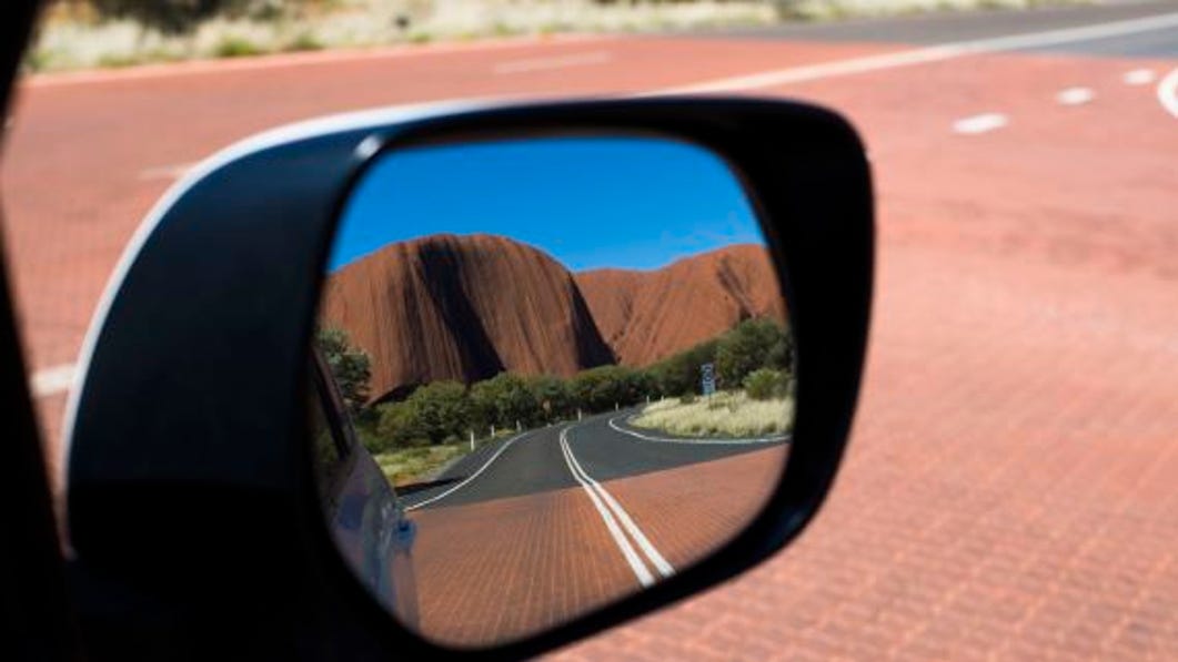 Reflection of kata tjuta in the-rear view mirror.jpg
