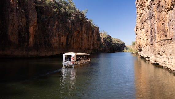 A boat cruise on a river overlooking the Katherine Gorge in the morning