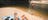 guyjumpingintothewaterholeatormistongorgewhilehisgirlfriendissunbathingonthesandyshorejpg