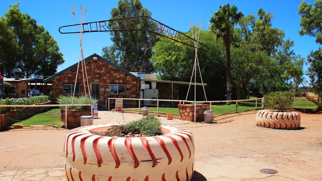 the front garden and enterance of curtin springs wayside inn