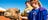 Kids petting a camel at Uluru Camel Tours