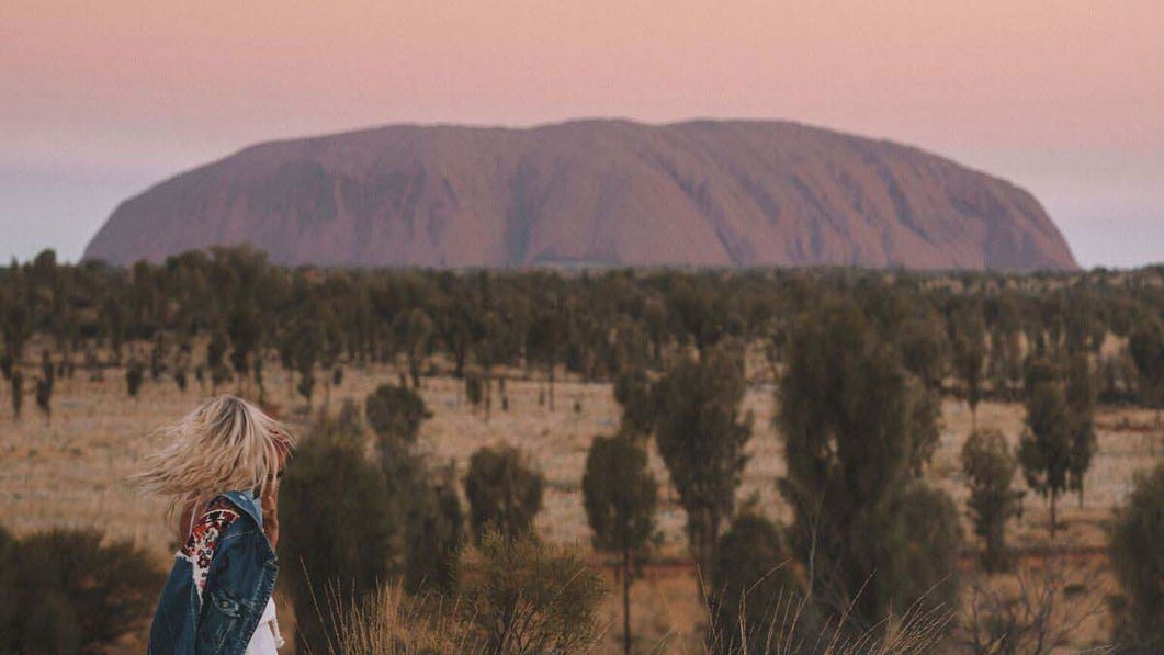 Girl looking at Uluru