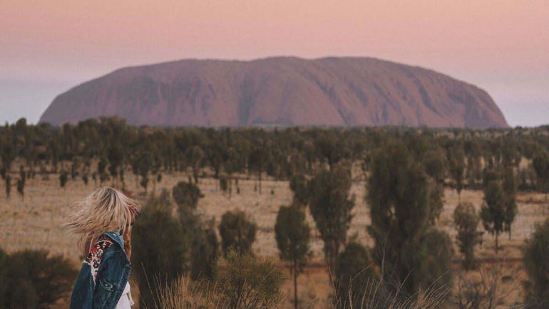 Girl looking at Uluru