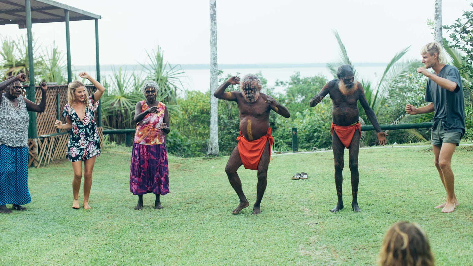 Aboriginal people dancing with visitors at the Tiwi Islands Clearwater Island Lodge