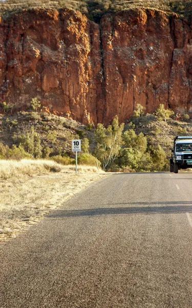 car-driving-through-the-west-macs-near-alice-springs-1jpg