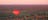 Hot air balloon glides over Alice Springs-landscape at sunrise
