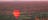 Hot air balloon glides over Alice Springs-landscape at sunrise