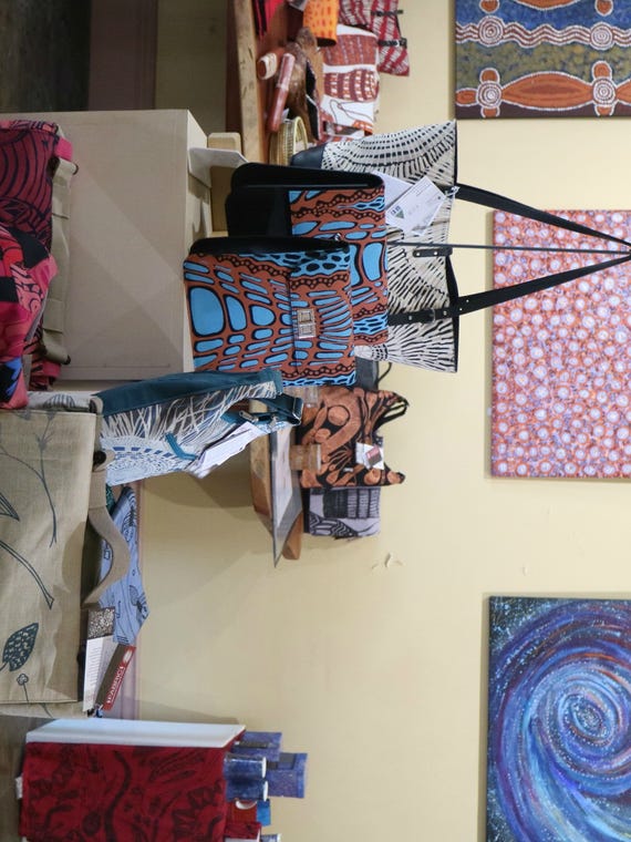 Aboriginally designed paintings and bags