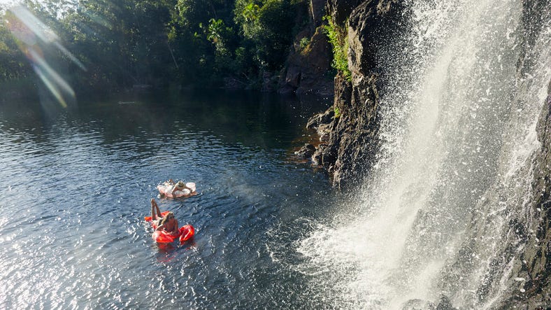 Two girls swimming at Wangi Falls in Litchfield National Park