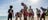 groupofaboriginalpeoplewithbodypaintonthebeachinarnhemland-1jpg