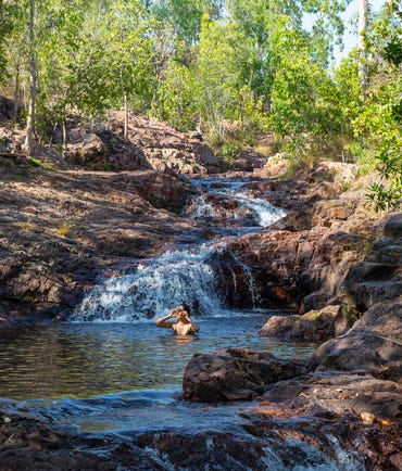 A woman swimming in the waters of the Buley Rockhole pool