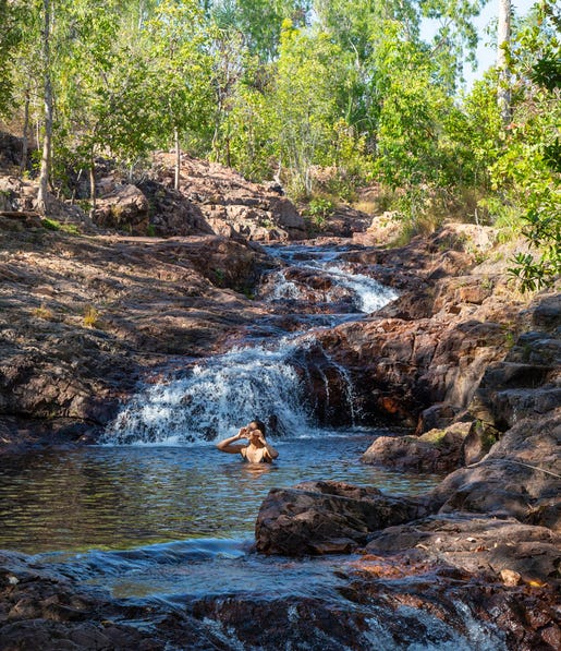 A woman swimming in the waters of the Buley Rockhole pool