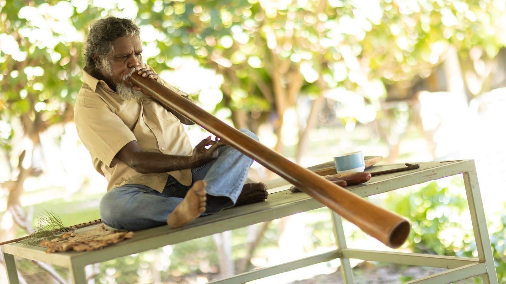 Aboriginal man playing the didgeridoo