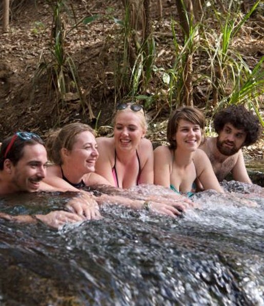 friends laying in the water of katherine hot springs