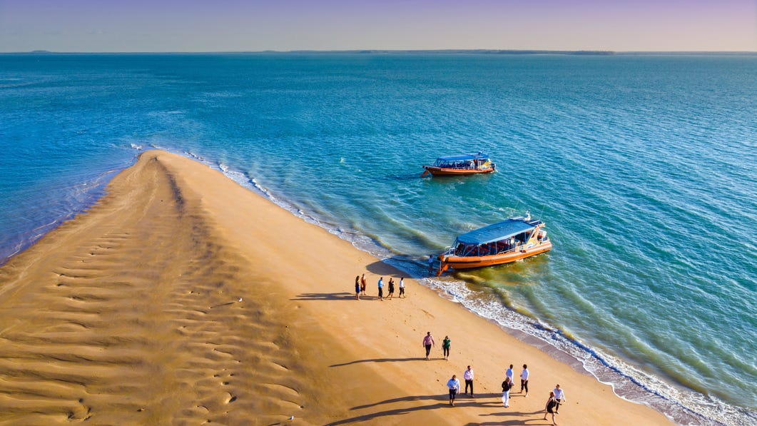 Darwin sandbar with boats and people