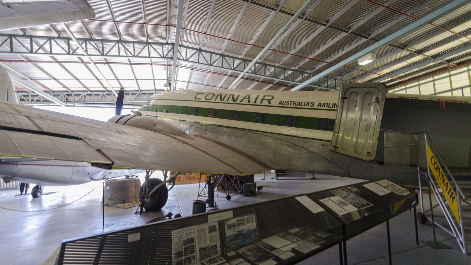 Connair airplane parked in the hangar of the Central Australian Aviation Museum