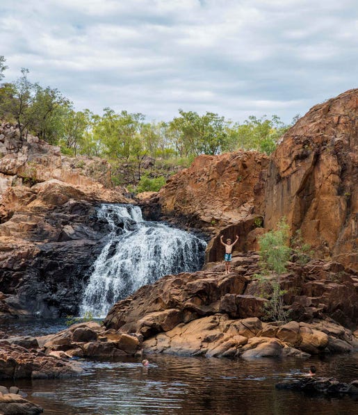 Boy standing on the rocks at Edith Falls near Katherine