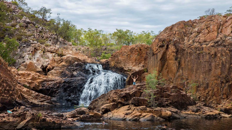 Boy standing on the rocks at Edith Falls near Katherine