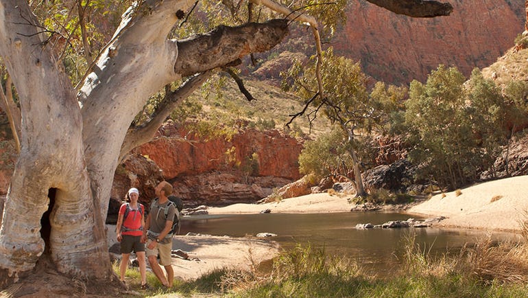 Couple hiking at Ormiston Gorge in the Macdonnell Ranges