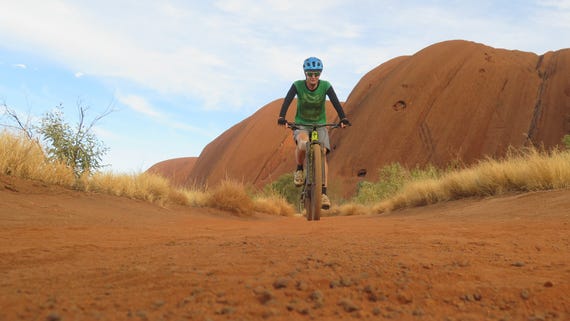 a-person-mountain-biking-in-uluru,-d-,jpg