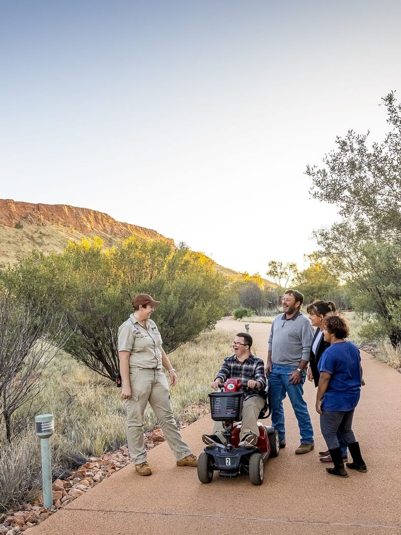 group of people listening to a guide at the Alice Springs Desert Park