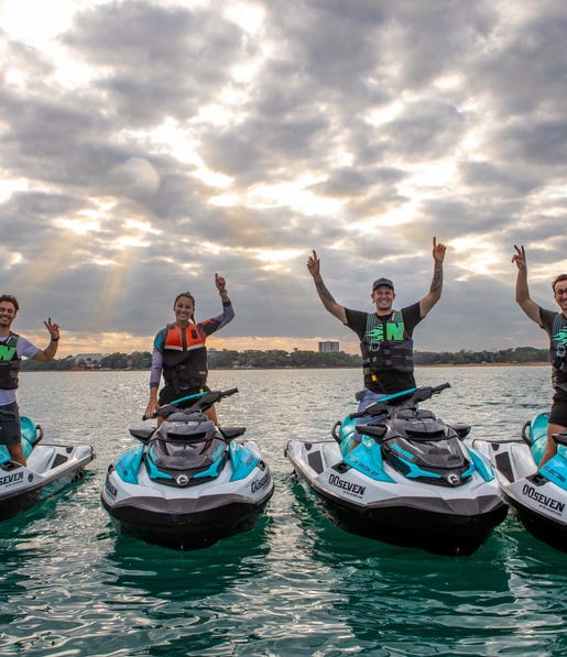 Four people standing on jetskis from 007 Jetski