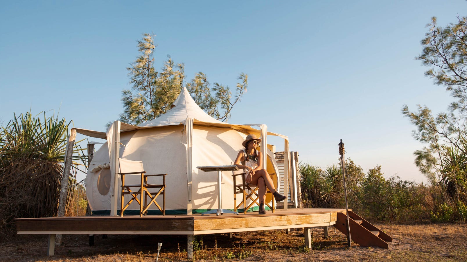 Girl sitting outside a glamping site at Top End Safaris