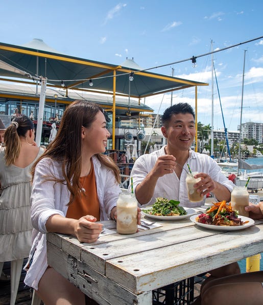 Group eating at the cullen bay marina