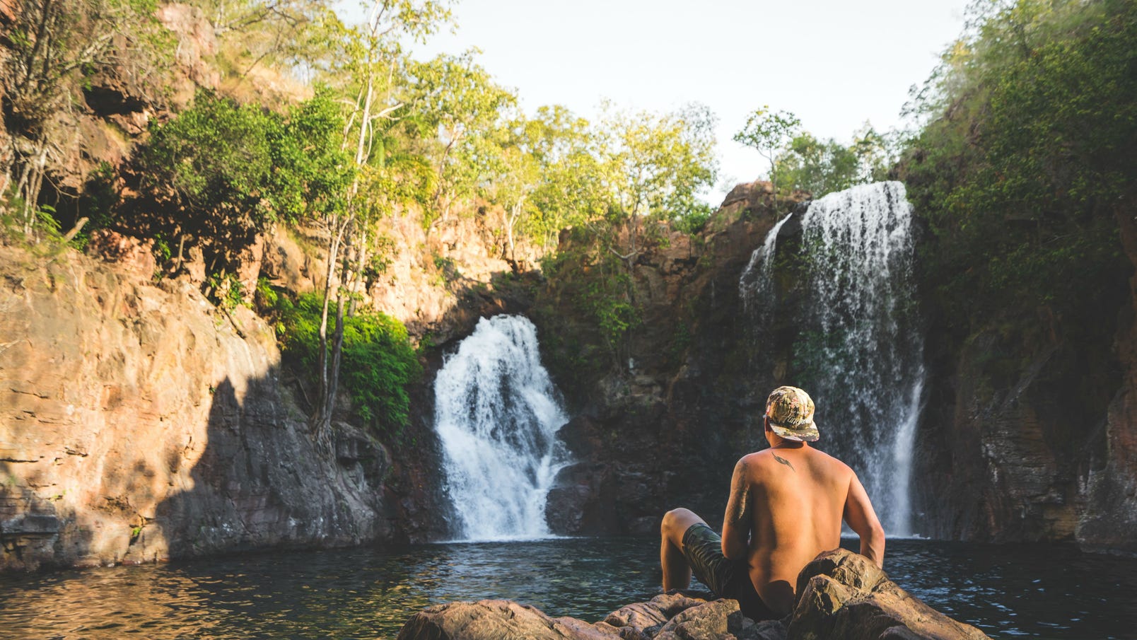 Man sitting in front of Florence Falls