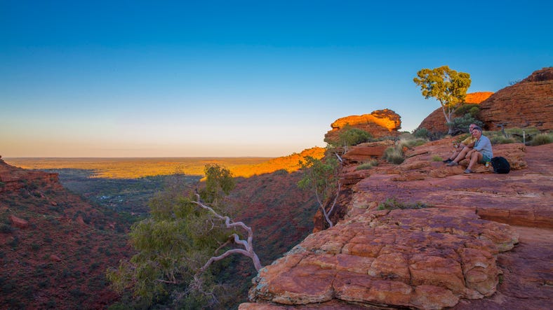 5-Couple sitting watching the sun set over Kings Canyon