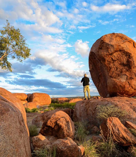 Man standing at Karlu Karlu Devils Matbles near Tennant Creek