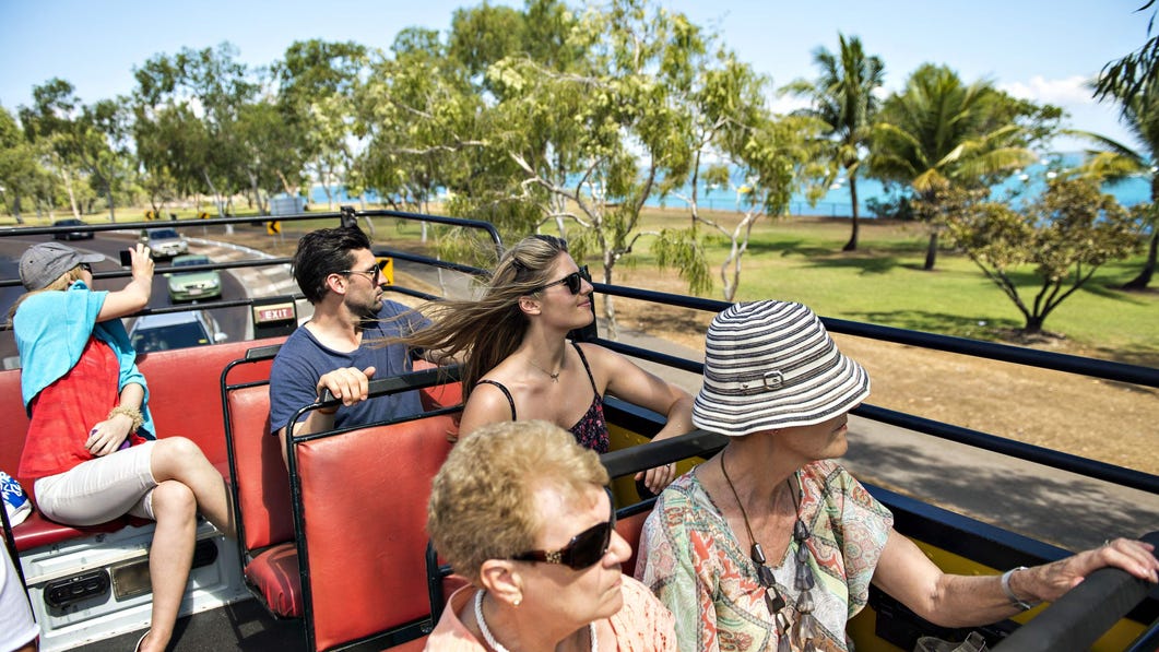 Visitors travelling on a bus tour to East Point