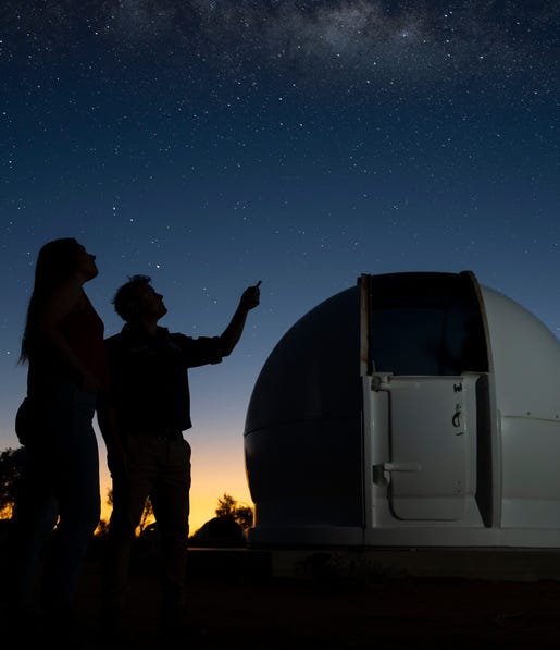 couple stargazing while at Earth Sanctuary