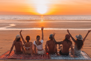 group of people sitting on mindil beach