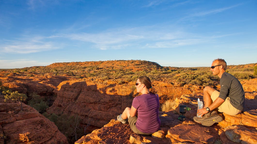 couple sitting near the edge of kings canyon looking out over the canyon,-d-,jpg
