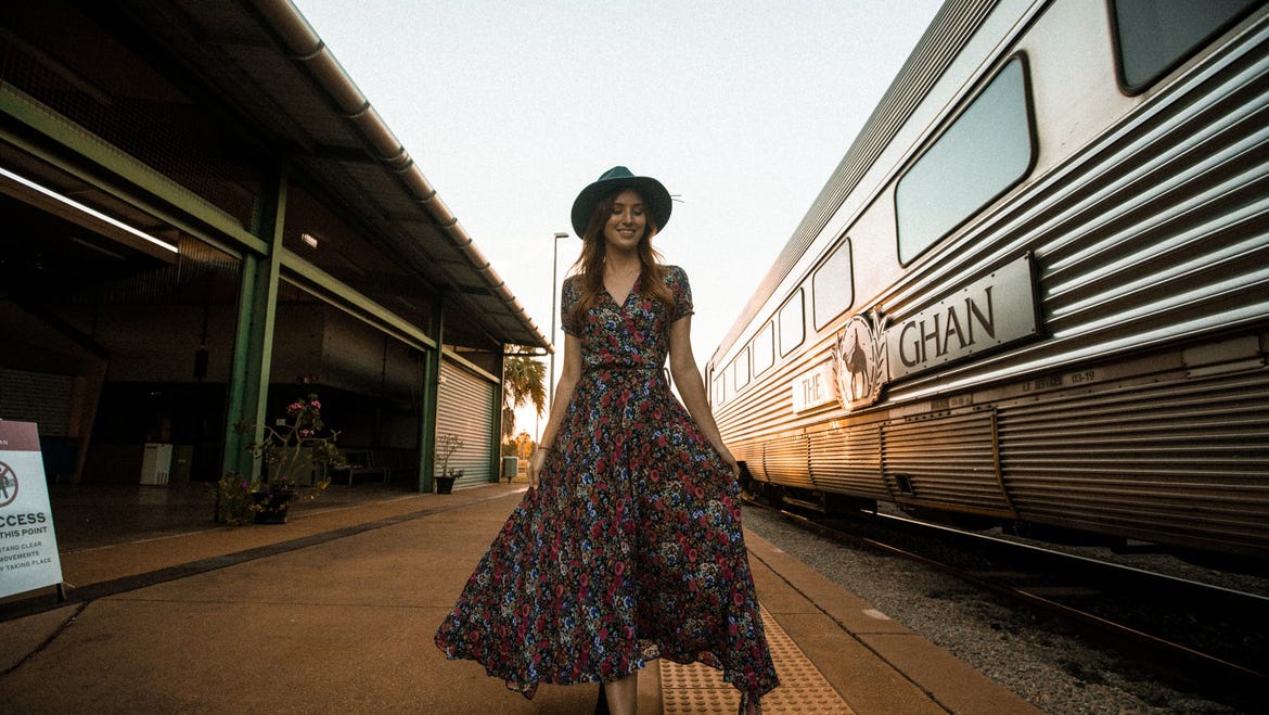 girlwalkingbesidetheghantrain-1jpg