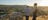 a_couple_walking_on_anzac_hill_overlooking_alice_springs_at_sunset