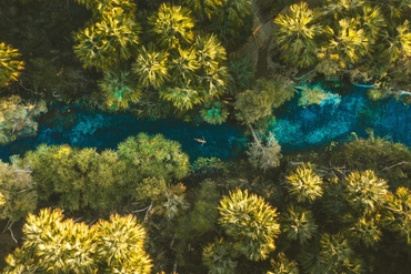 Aerial view of a girl floating in Bitter Springs (1)