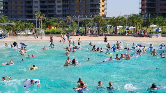 Lots of people enjoying a swim in the Darwin Wave Pool