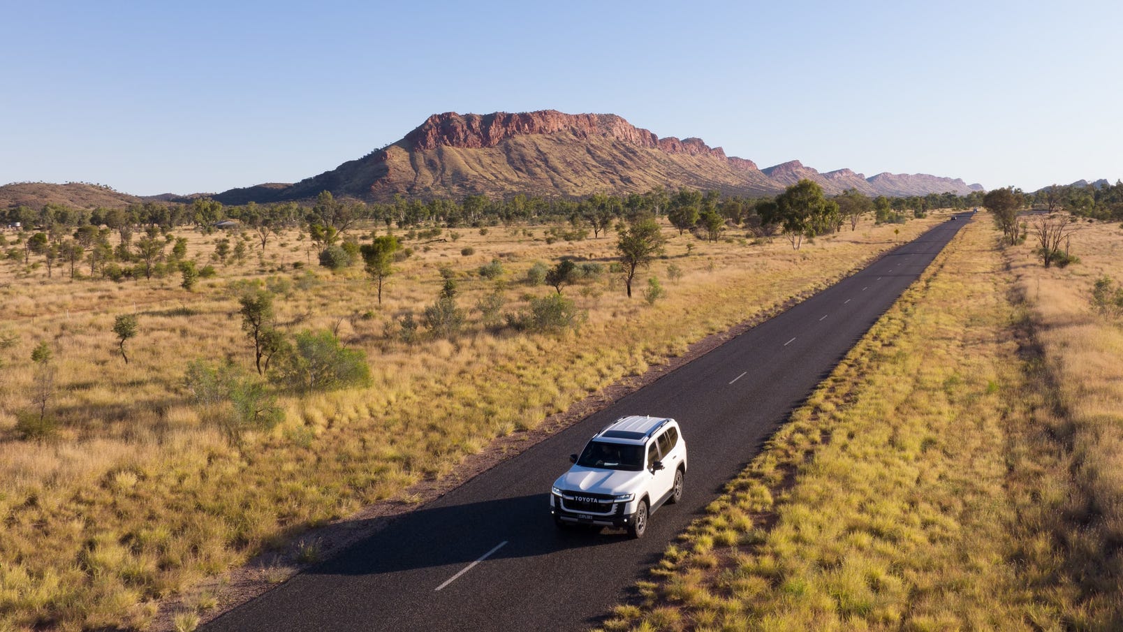 Car driving through the West MacDonnell Ranges