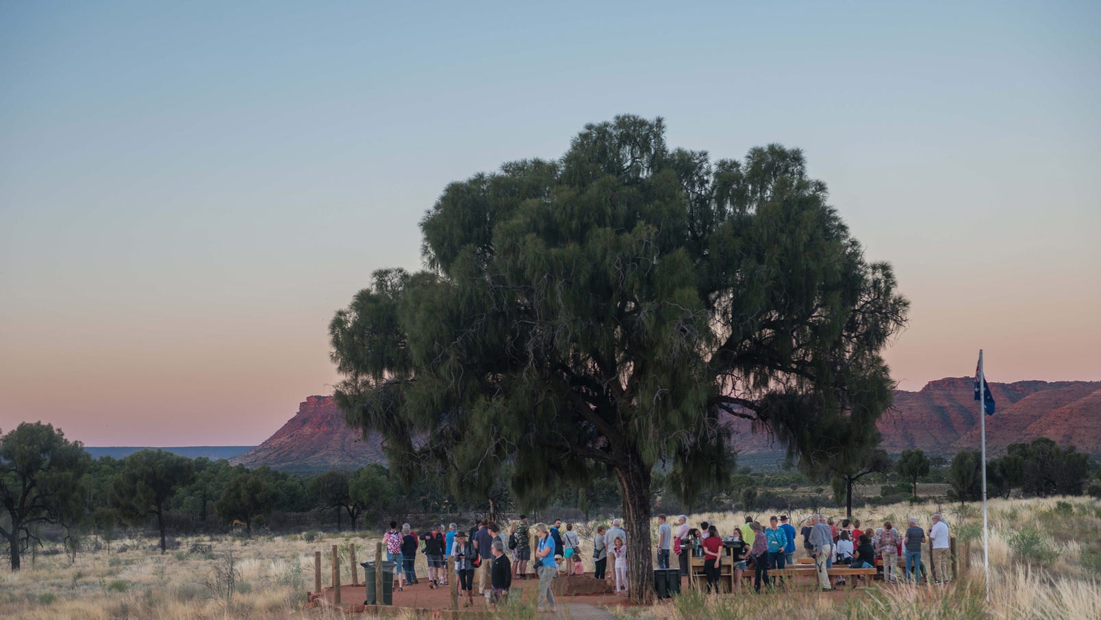 A group of people enjoying the view of Kings Canyon at sunset